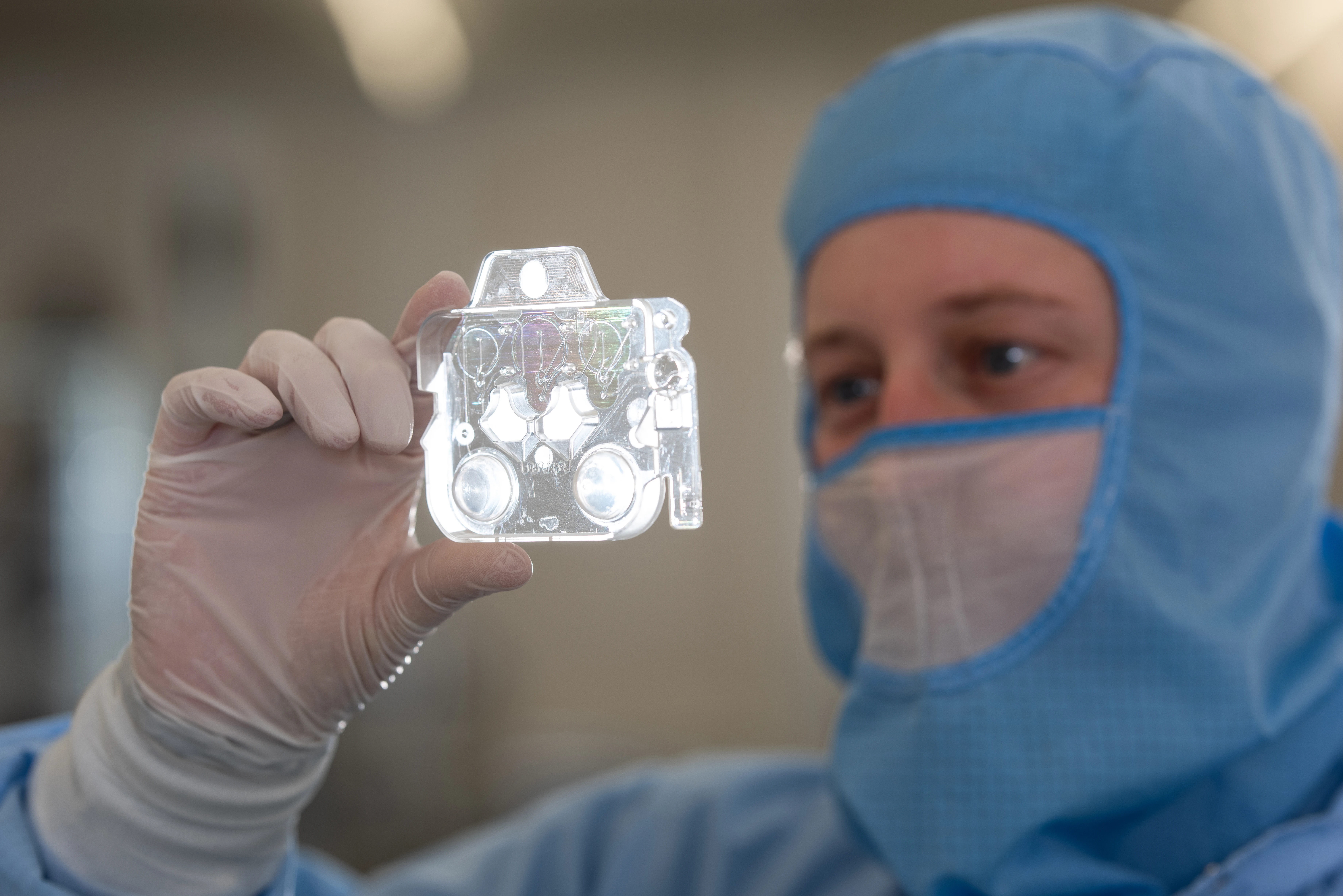 Person holding a Microfluidic Cartridge